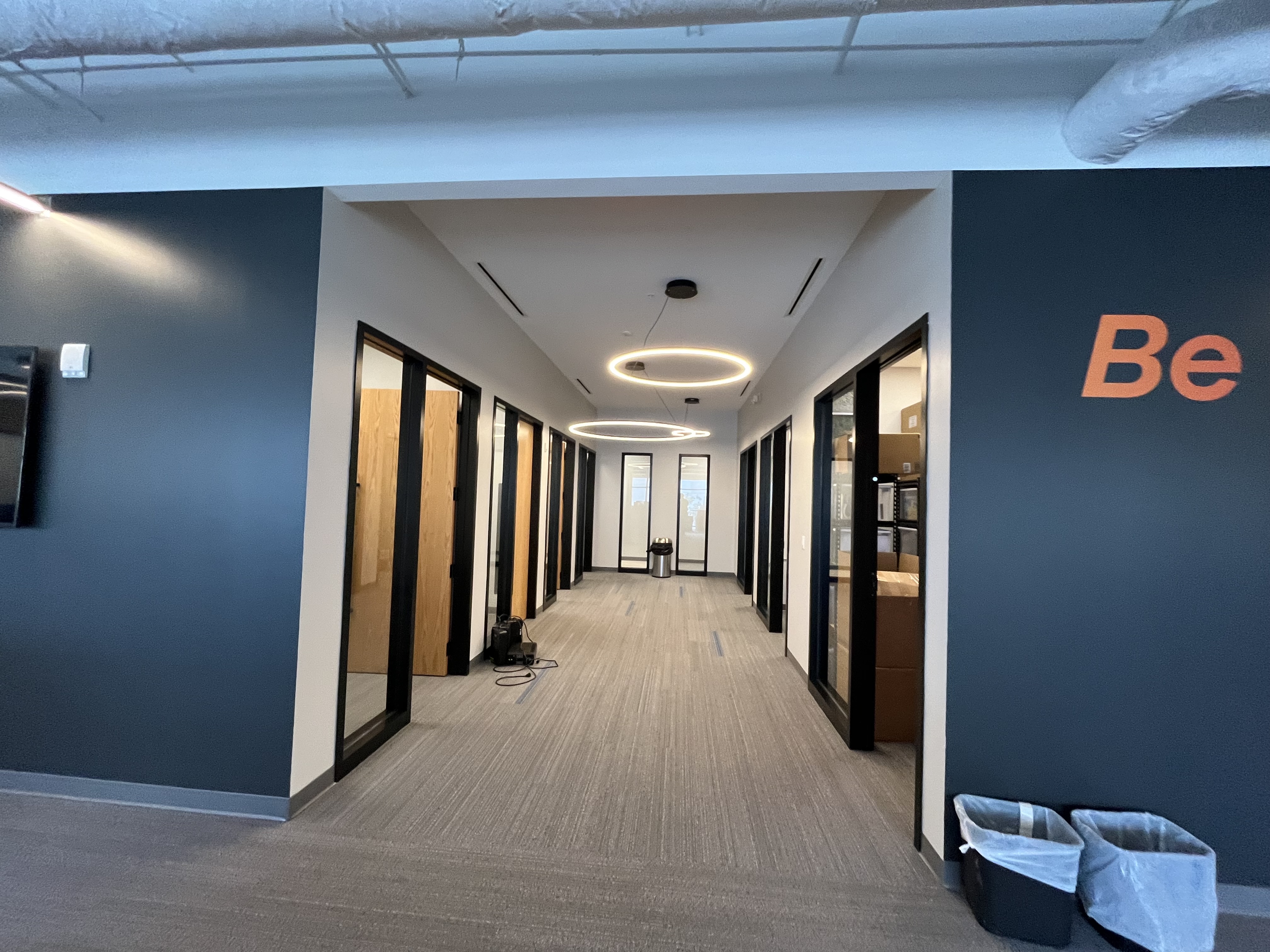 Commercial office interior painting navy accent walls by HPC Florida