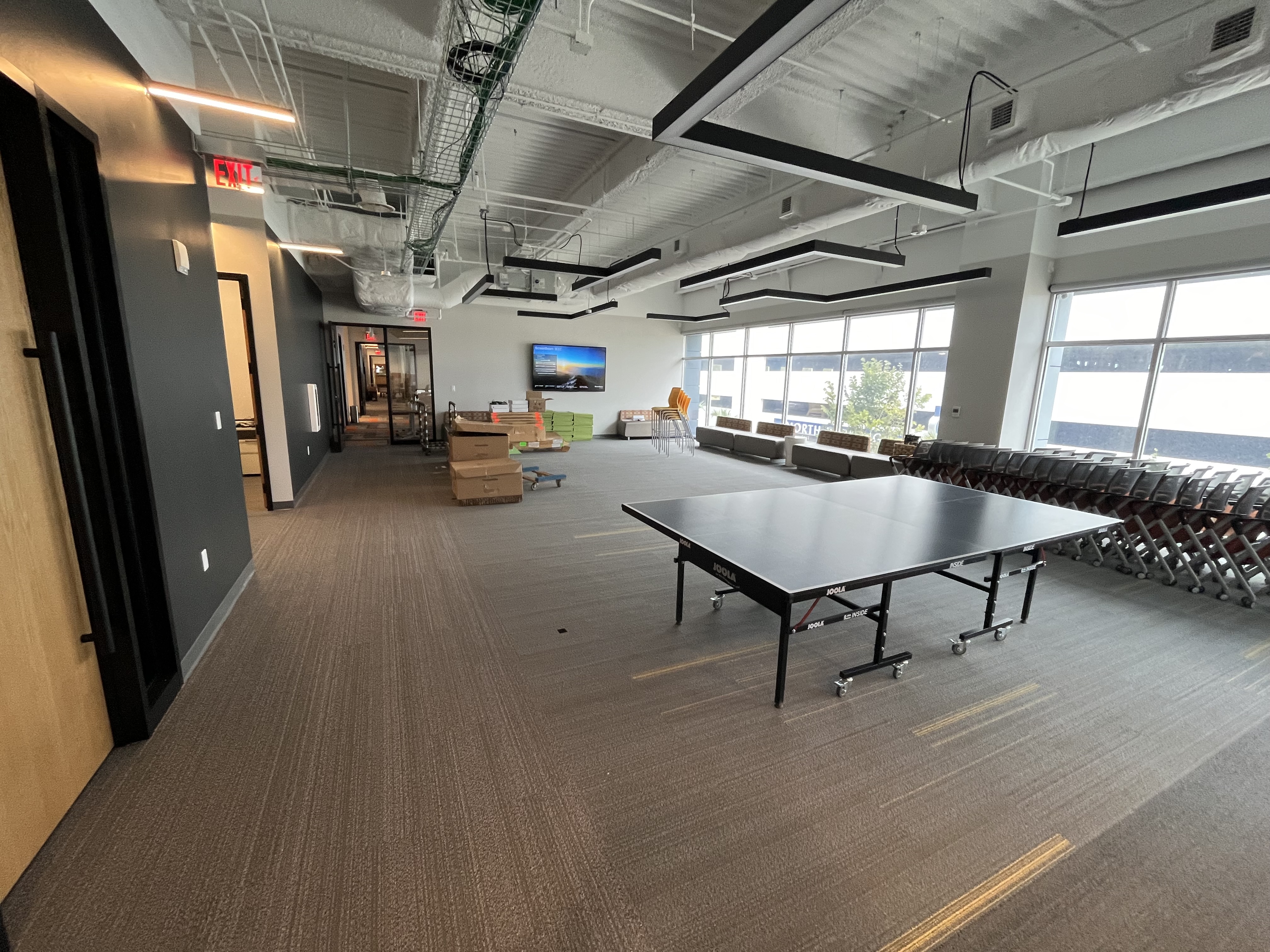 Corporate office recreation lounge interior painting charcoal walls by HPC Jacksonville Florida
