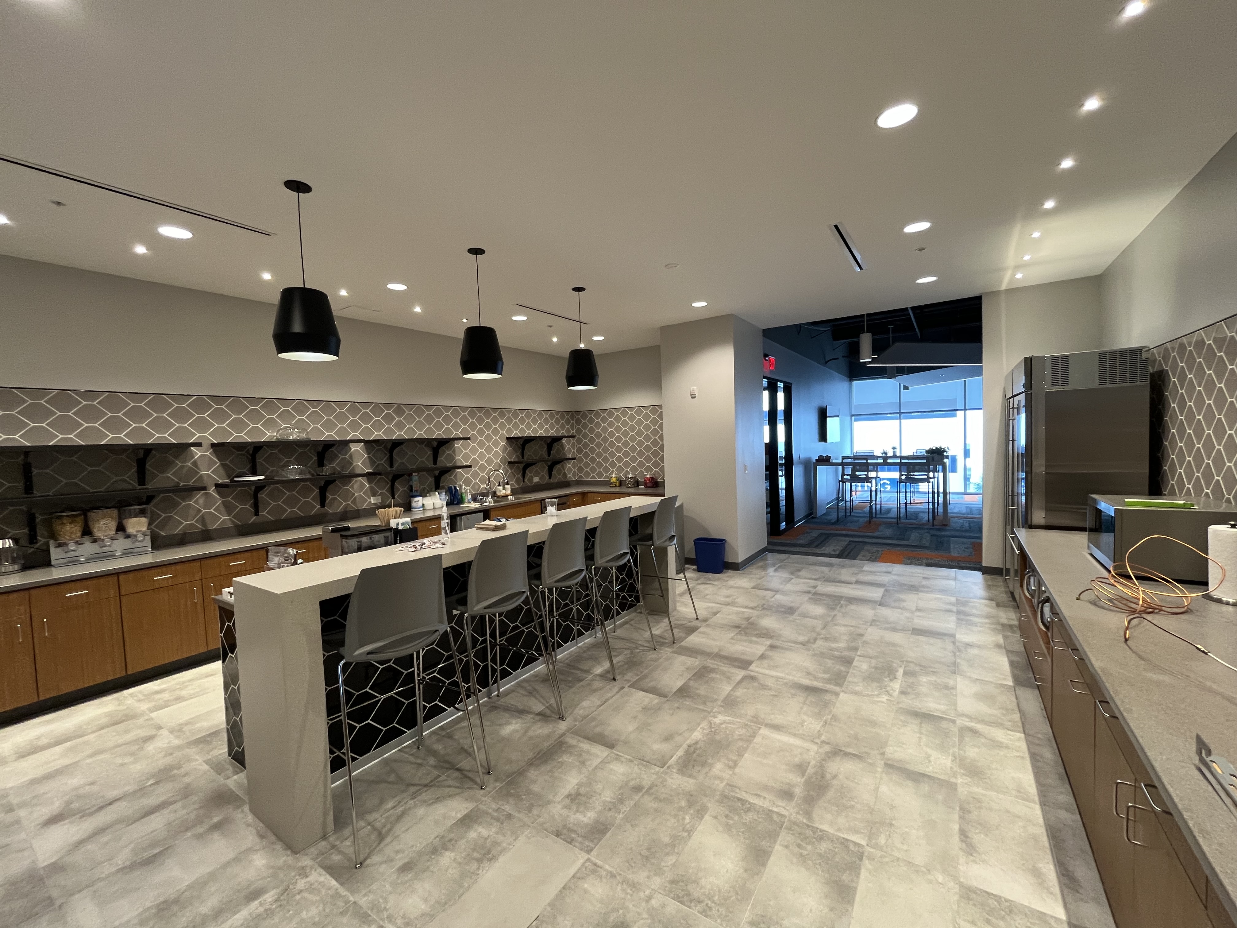 Commercial break room kitchen interior painting neutral gray by HPC Jacksonville Florida