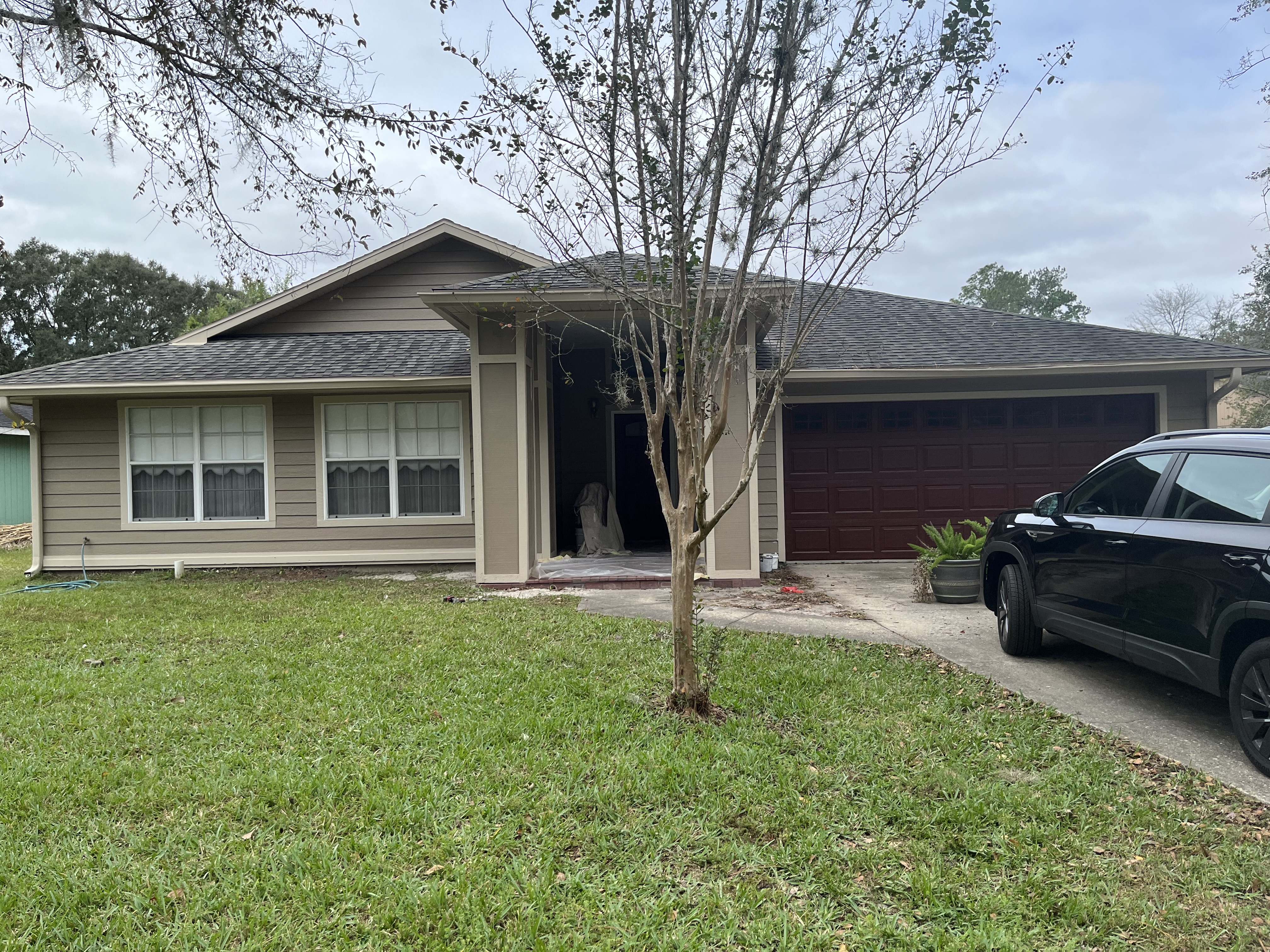 Large estate exterior painting with ranch fence by HPC in Ocala Florida