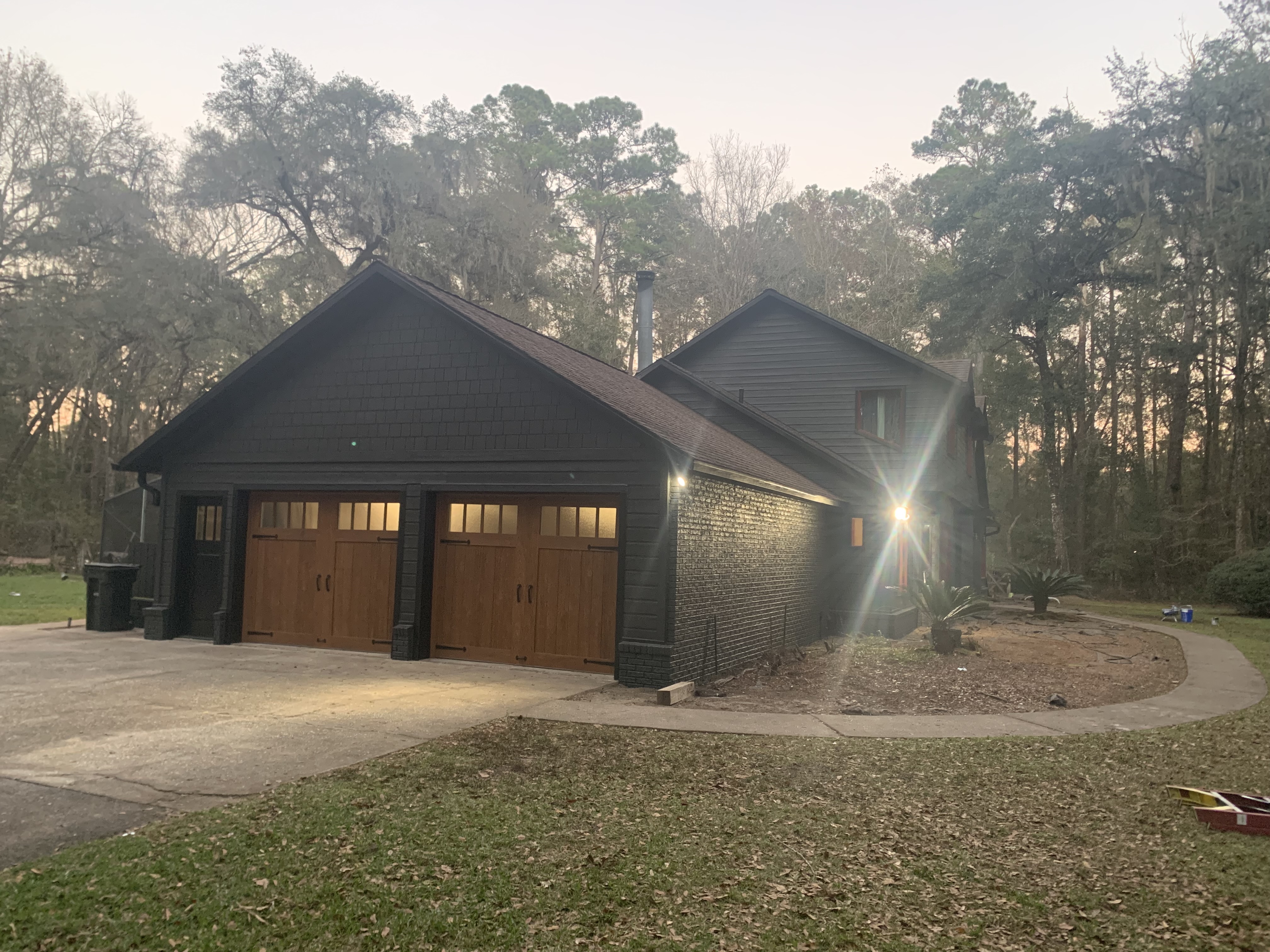 Residential exterior house painting dark charcoal finish by HPC in Gainesville Florida