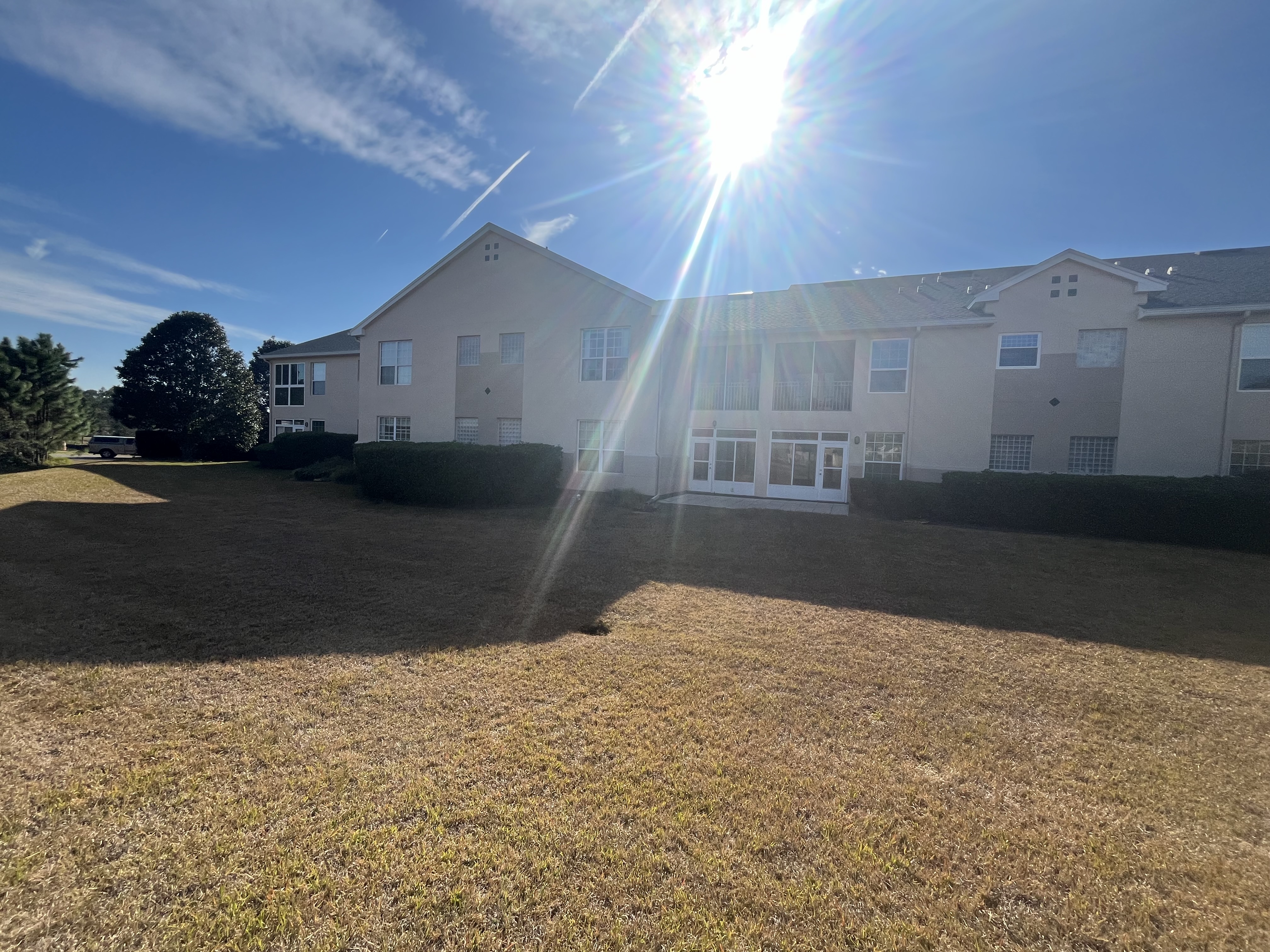 Apartment complex exterior painting tan stucco by HPC Florida