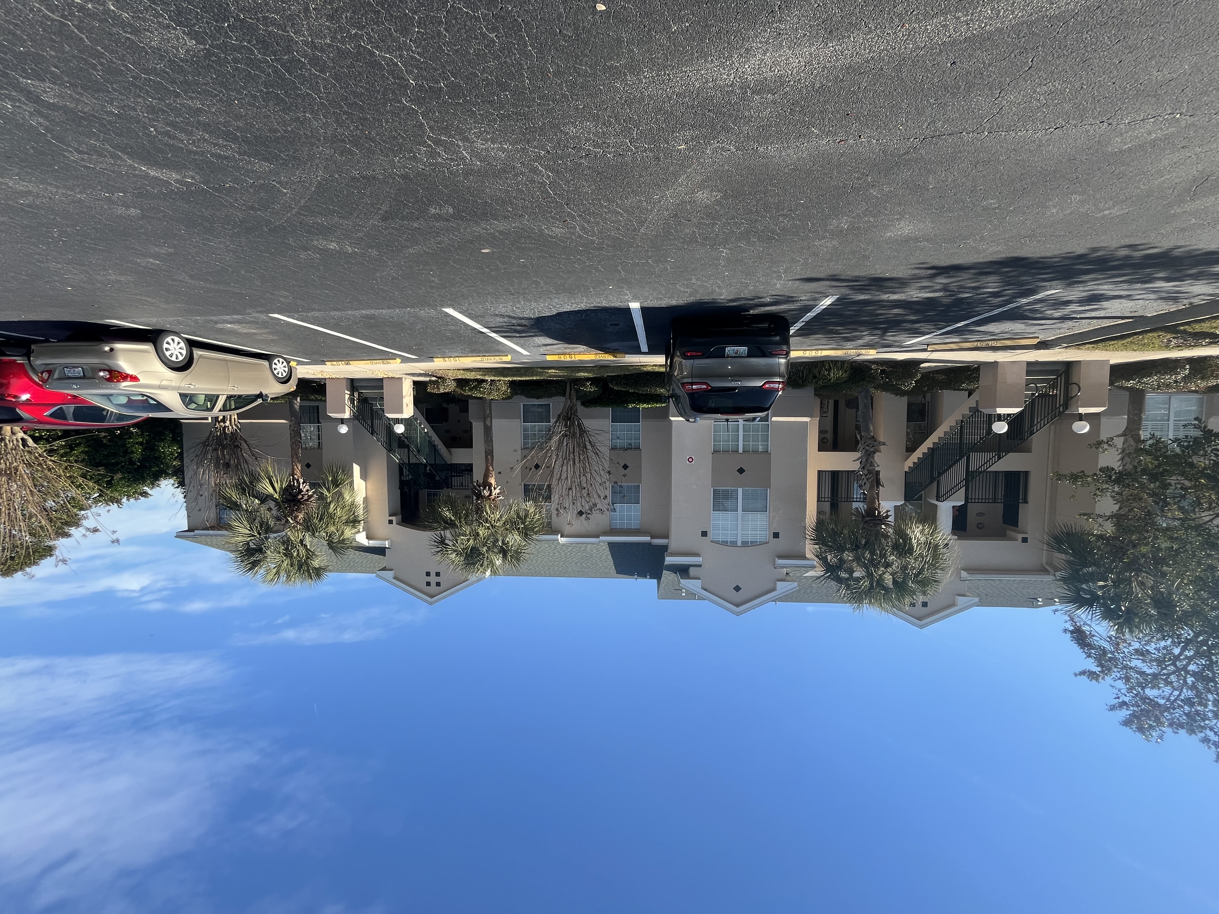 Apartment complex building B exterior painting tan stucco by HPC Florida