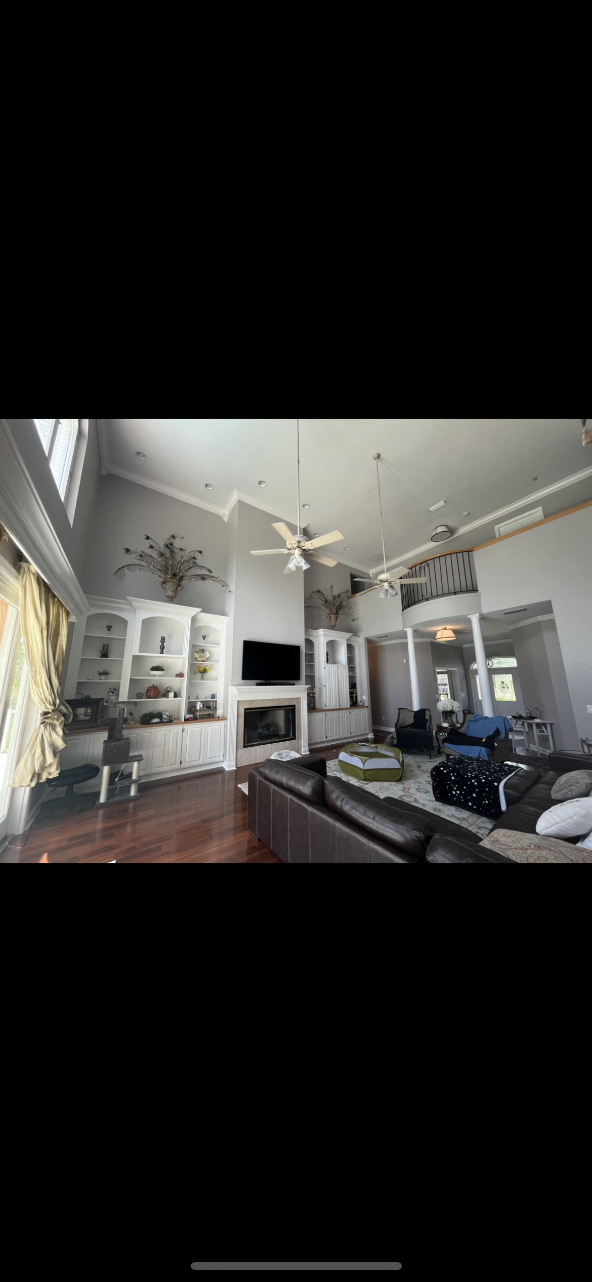 Grand living room interior painting gray walls white trim by HPC in Ocala Florida
