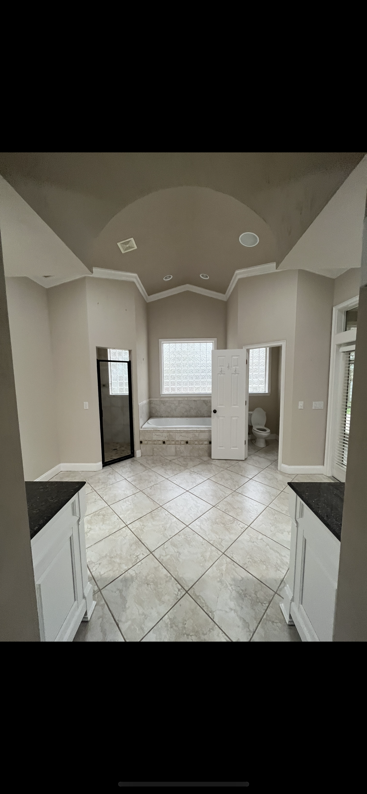 Master bathroom interior painting vaulted ceiling greige walls by HPC in Jacksonville Florida
