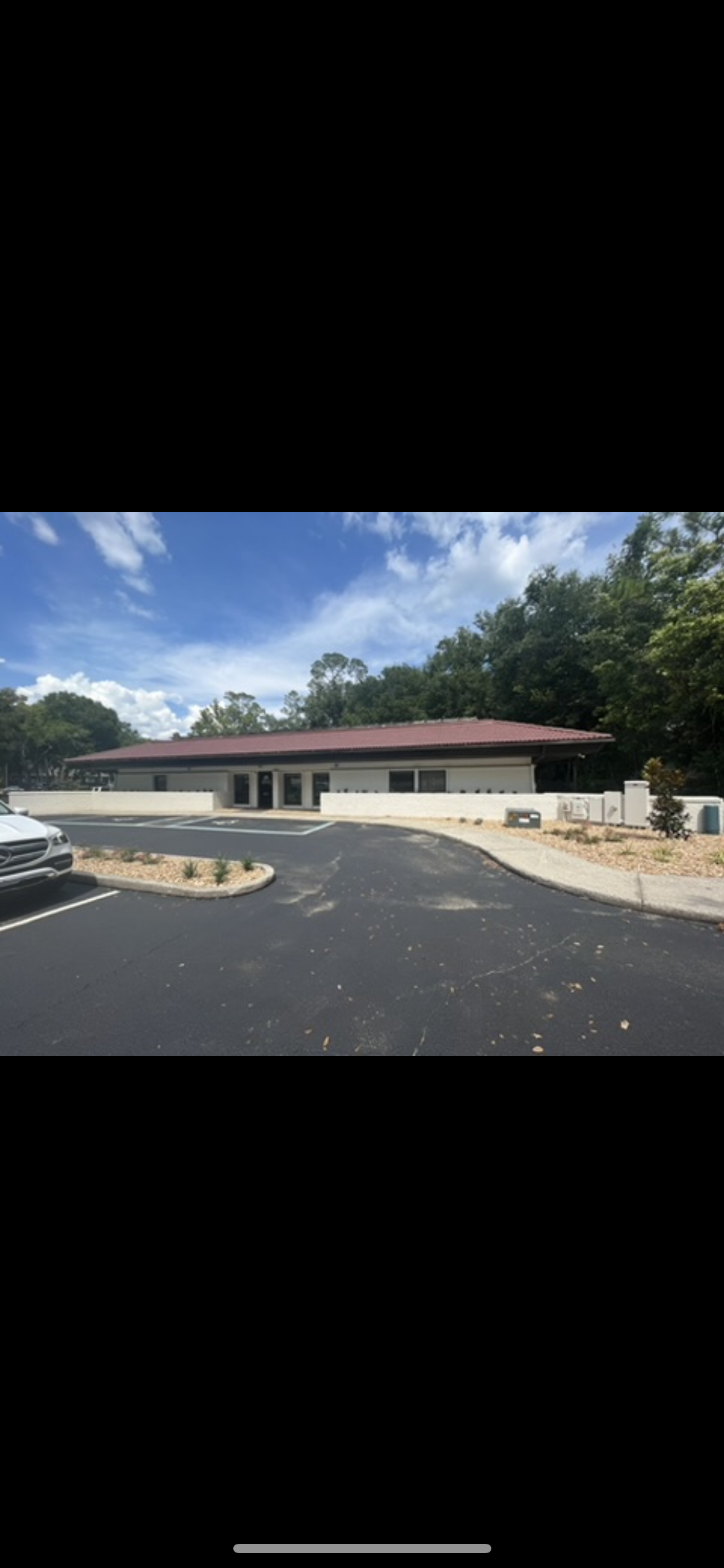 Medical office building exterior painting tan stucco by HPC in Gainesville Florida