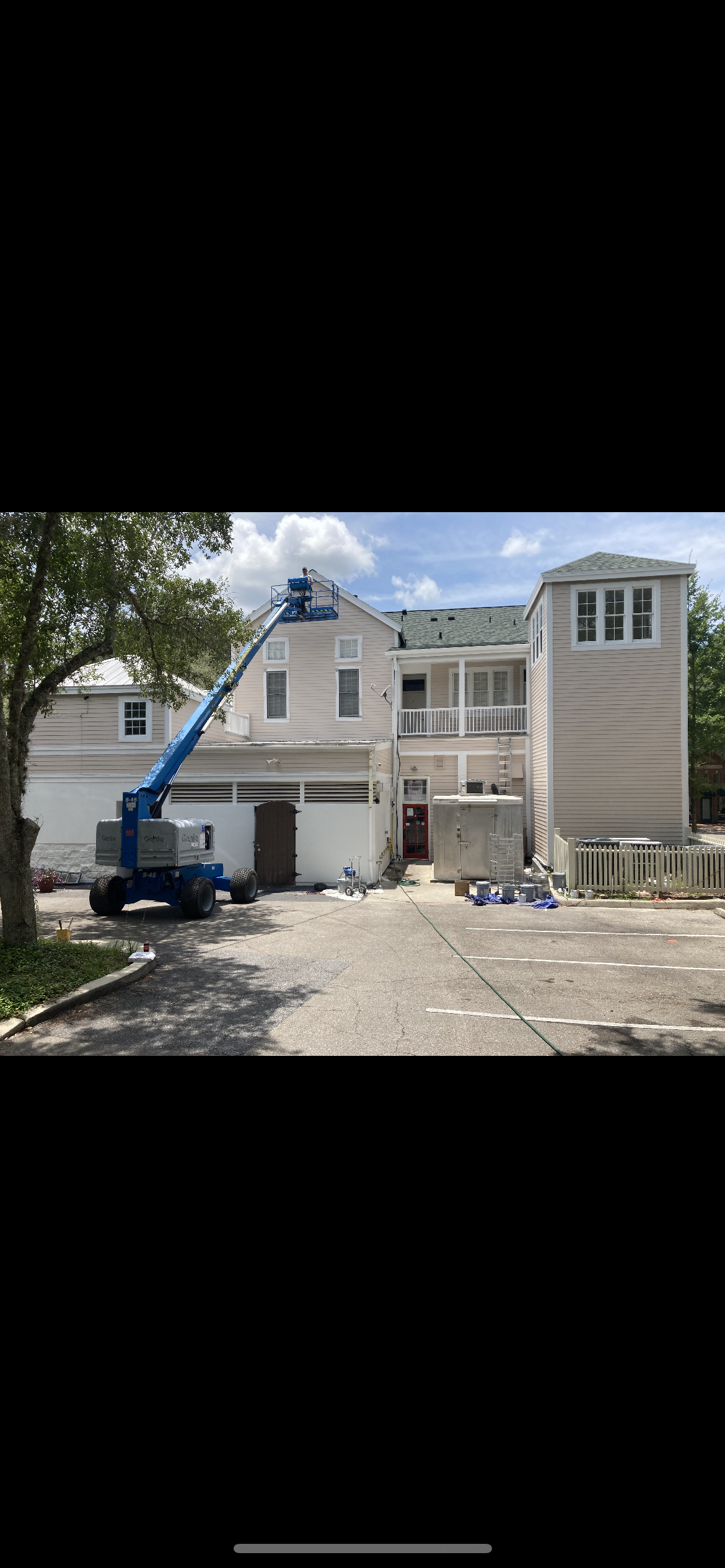 Multi story commercial exterior painting with boom lift by HPC Florida