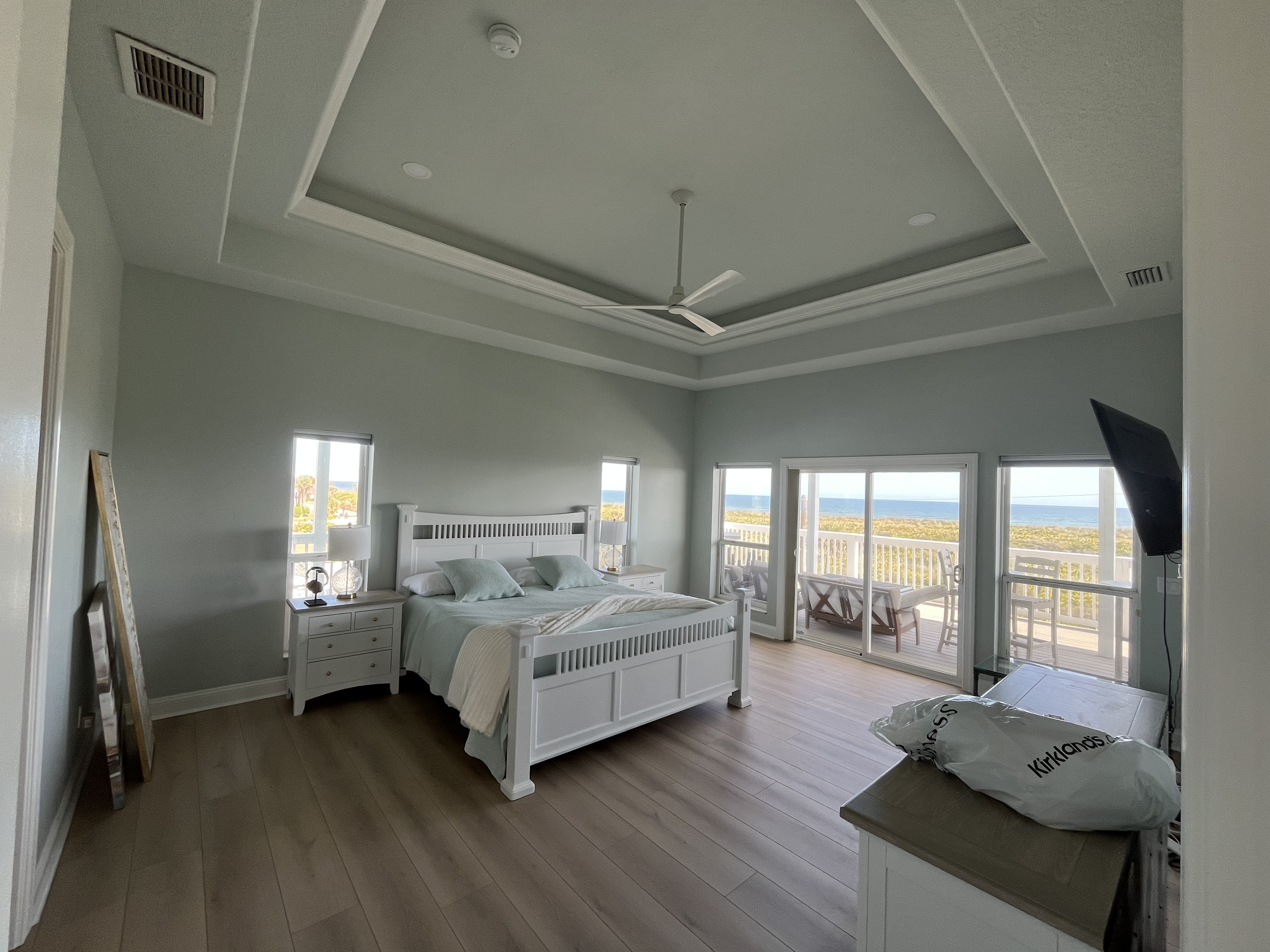 Beach house kitchen wide angle interior painting white cabinets by HPC in St. Augustine Florida