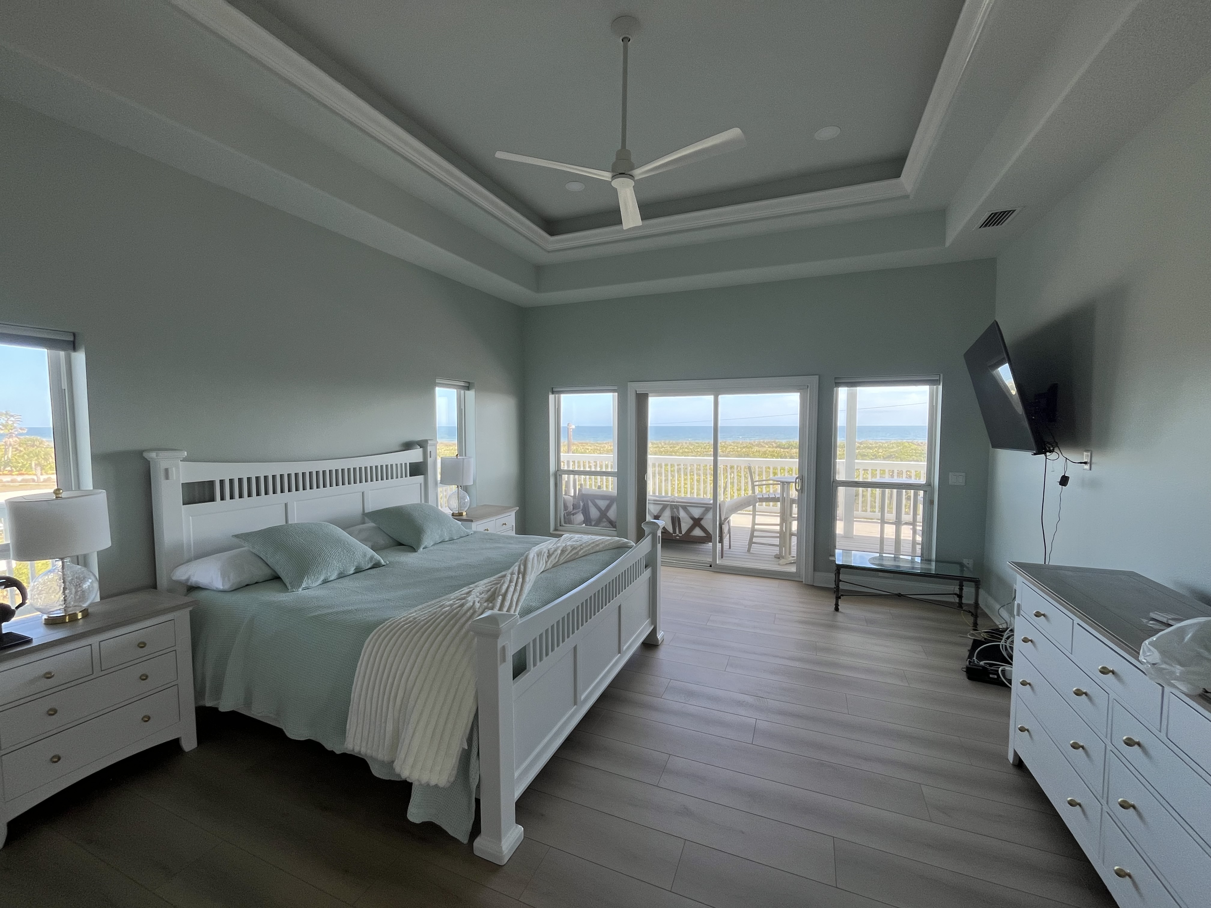 Beach house kitchen detail interior painting white cabinets blue gray walls by HPC in St. Augustine Florida