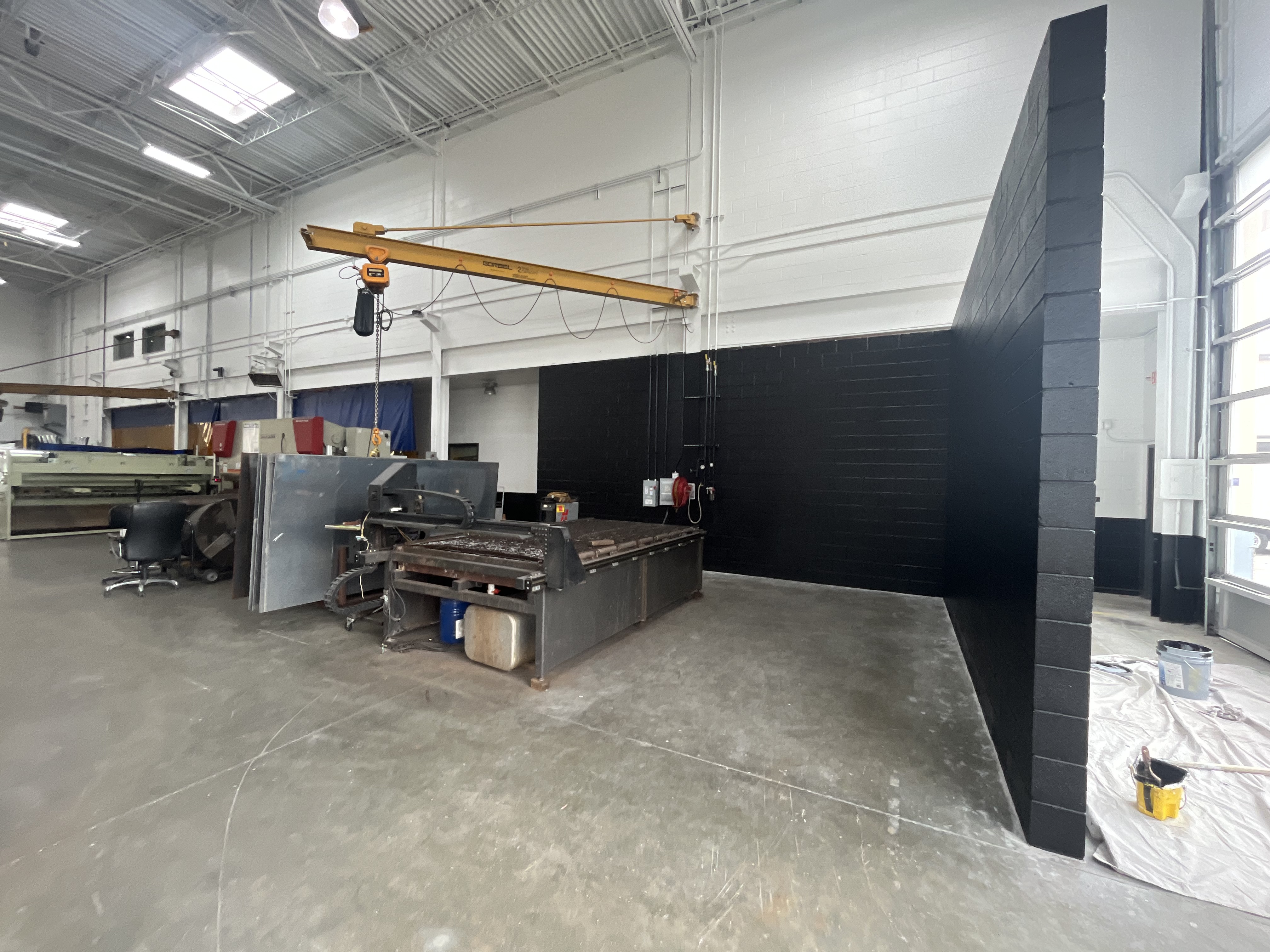 Warehouse interior painting black feature wall industrial by HPC Florida