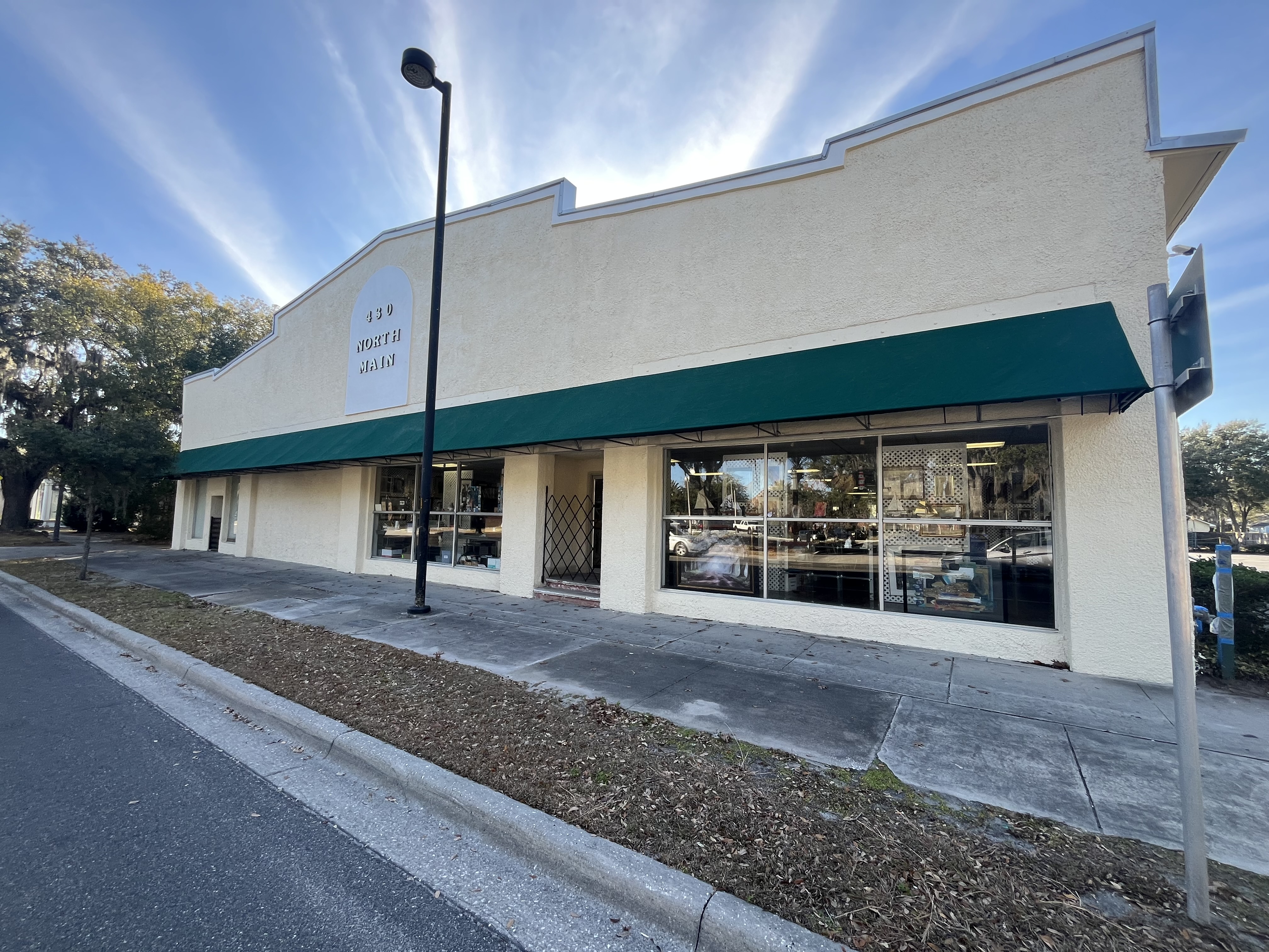 Retail storefront exterior painting cream stucco by HPC Florida