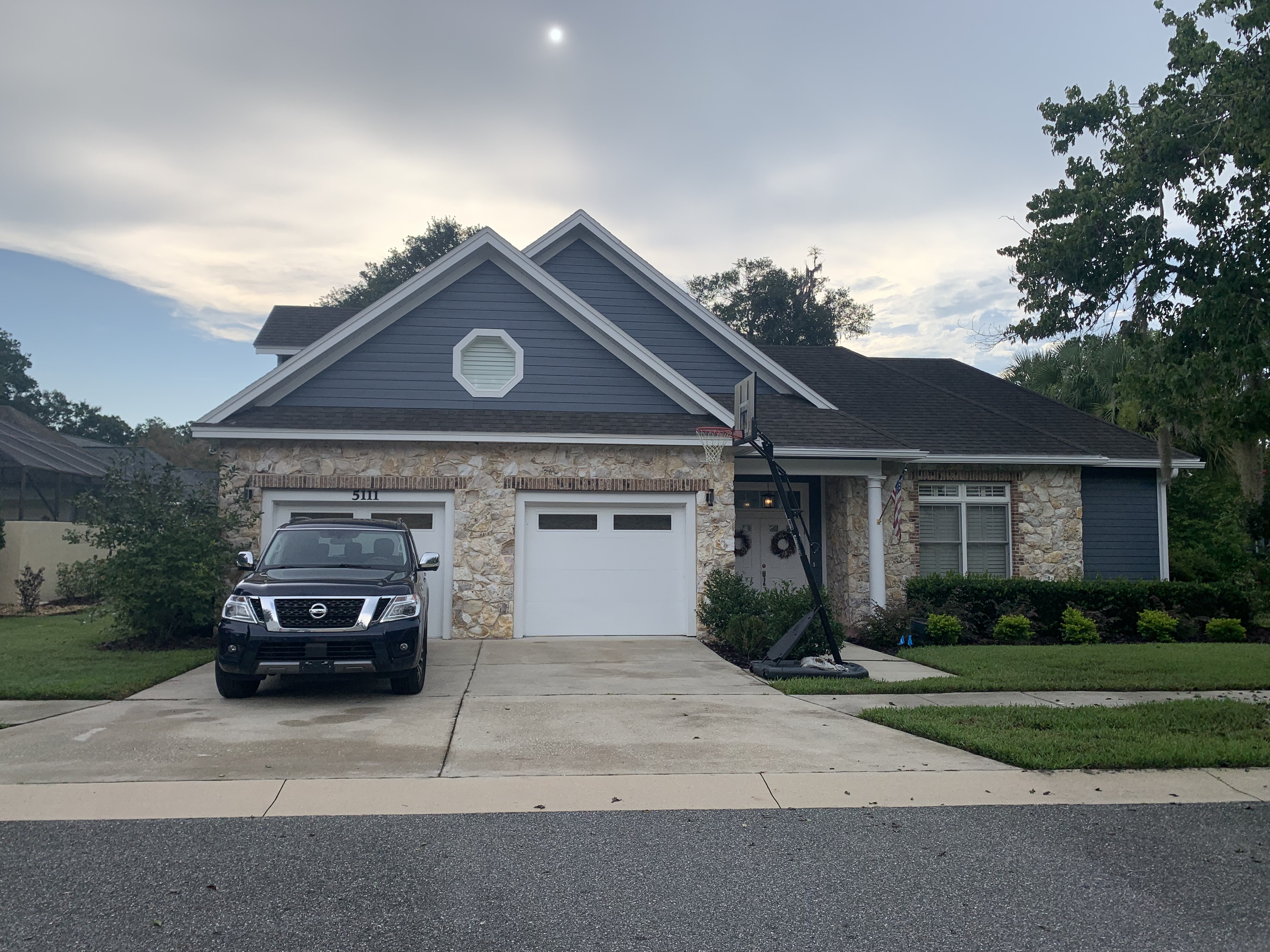 Exterior siding painting slate blue finish by HPC in Gainesville Florida
