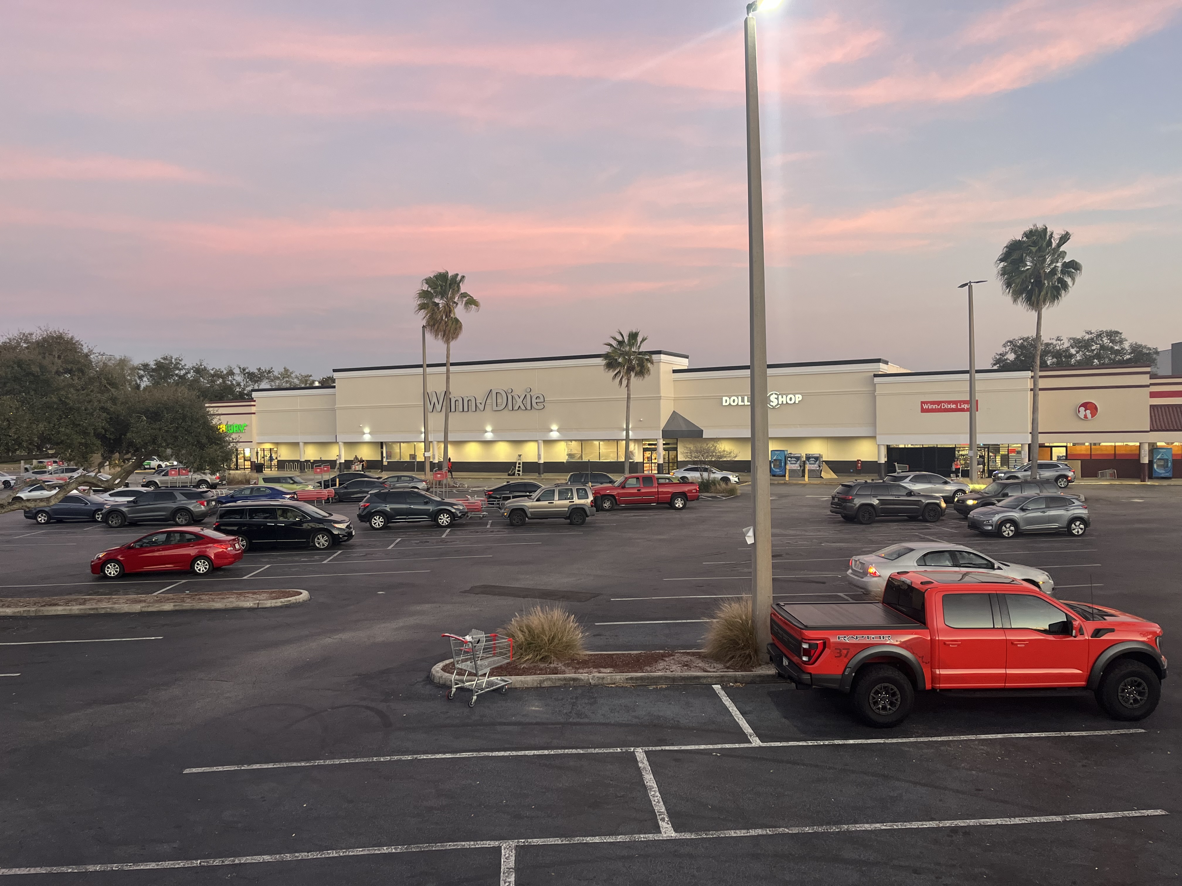 Winn-Dixie shopping center exterior before painting dusk view by HPC Florida